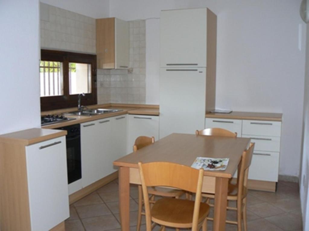 فيلابوتزو Residence Il Borgo Di Porto Corallo الغرفة الصورة